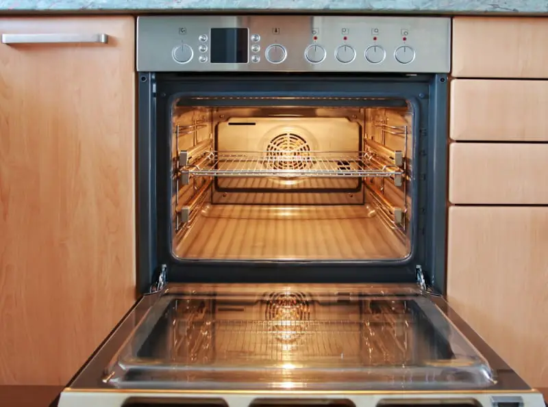 open oven with a light on inside