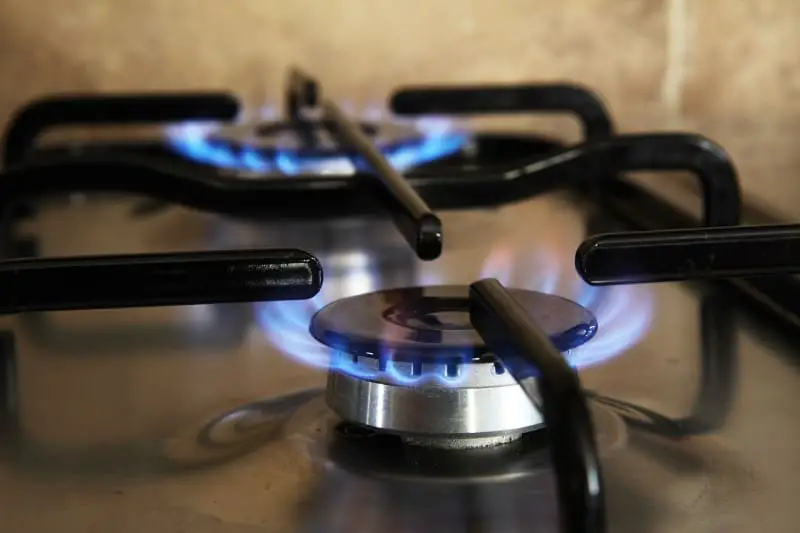 Pre-lit gas stove with blue flame